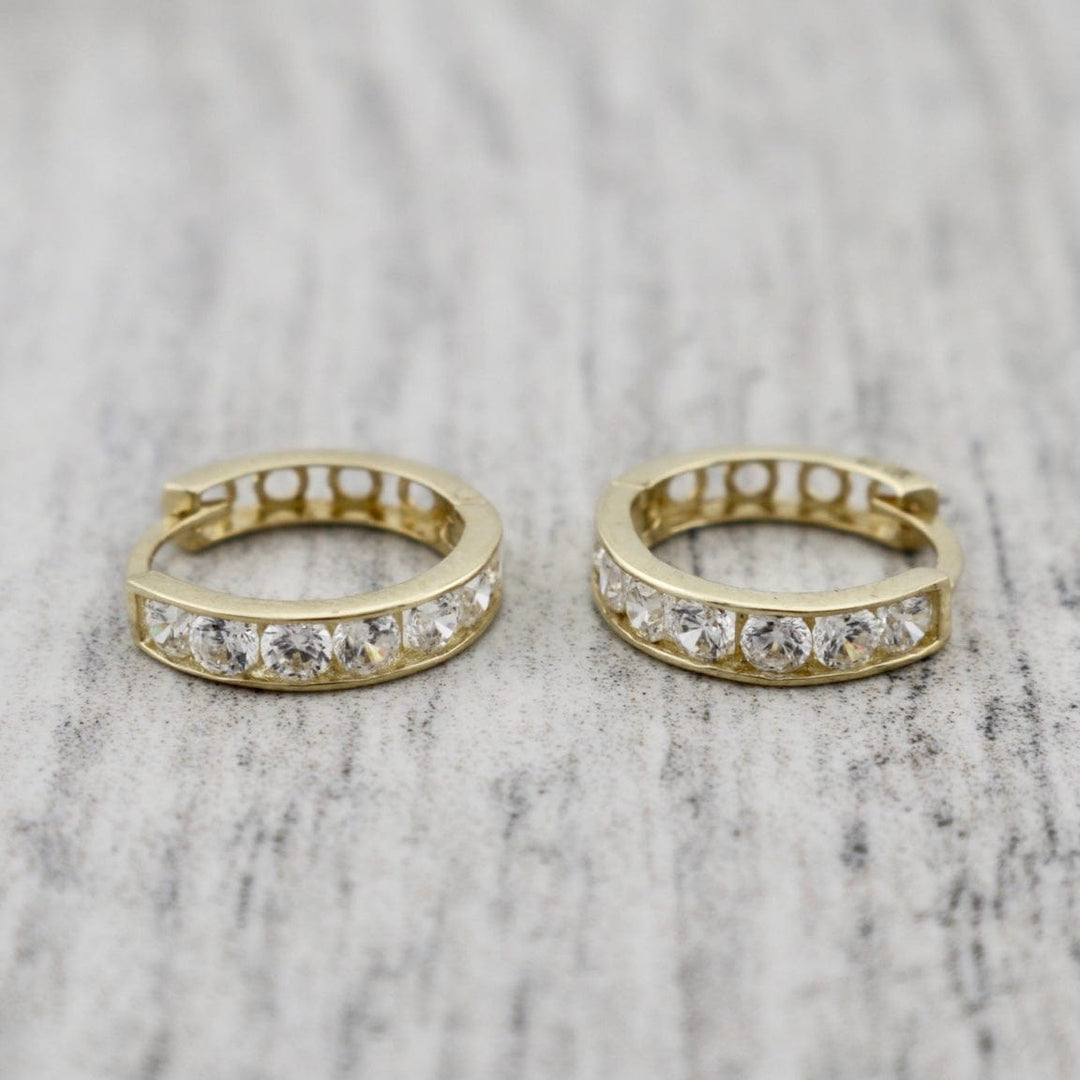 - Boucles d'oreilles Boucles d'oreilles huggies Éclats en or 10K