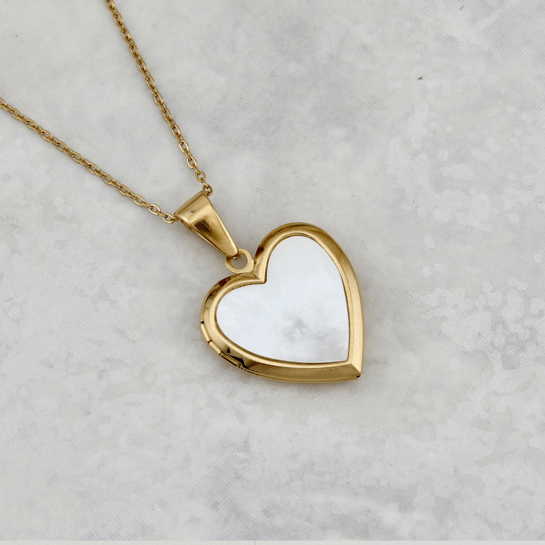 Collier porte photos Cœur en acier inoxydable Mathieu Blanchard Pendants Acier inoxydable plaqué or jaune PCODM14183S Collier porte-photos Coeur en nacre de perle en acier inox Mathieu Blanchard Joaillerie