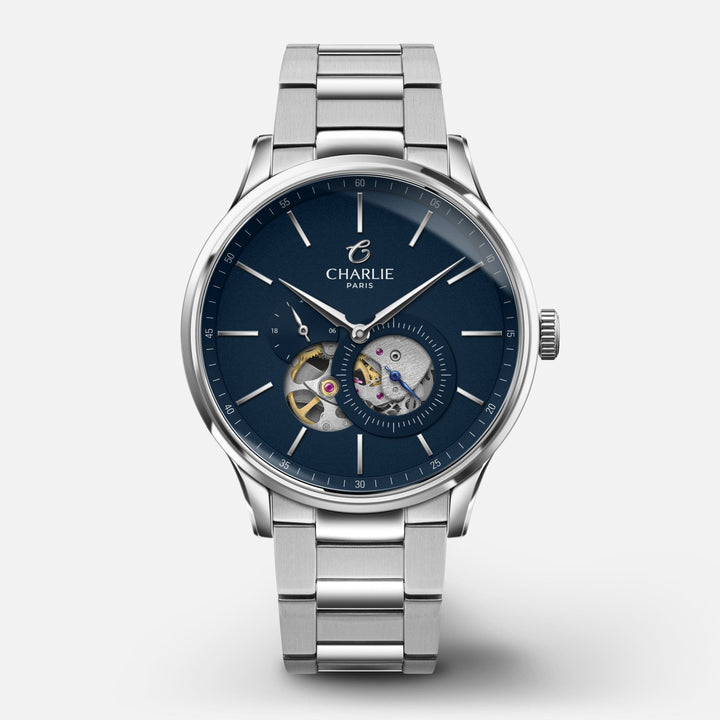 Montre Charlie Paris INITIAL Open Heart Bleu 40 mm en acier inoxydable Charlie Paris Montre 3-link stainless steel / Acier inoxydable ICO-40-009 / B-ICO / m-ICO Montre Charlie Paris INITIAL Open Heart - Bleu 40 mm | Dépositaire Officiel Canada | Mathieu Blanchard Joaillerie Mathieu Blanchard Joaillerie