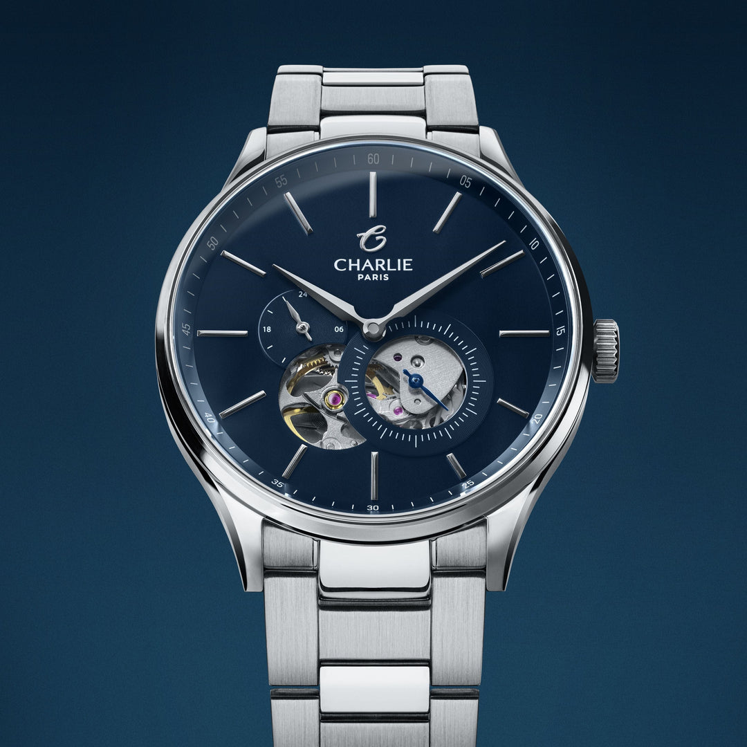 Montre Charlie Paris INITIAL Open Heart Bleu 40 mm en acier inoxydable Charlie Paris Montre Montre Charlie Paris INITIAL Open Heart - Bleu 40 mm | Dépositaire Officiel Canada | Mathieu Blanchard Joaillerie Mathieu Blanchard Joaillerie