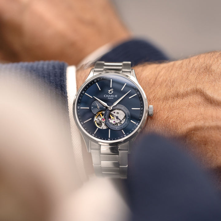 Montre Charlie Paris INITIAL Open Heart Bleu 40 mm en acier inoxydable Charlie Paris Montre Montre Charlie Paris INITIAL Open Heart - Bleu 40 mm | Dépositaire Officiel Canada | Mathieu Blanchard Joaillerie Mathieu Blanchard Joaillerie
