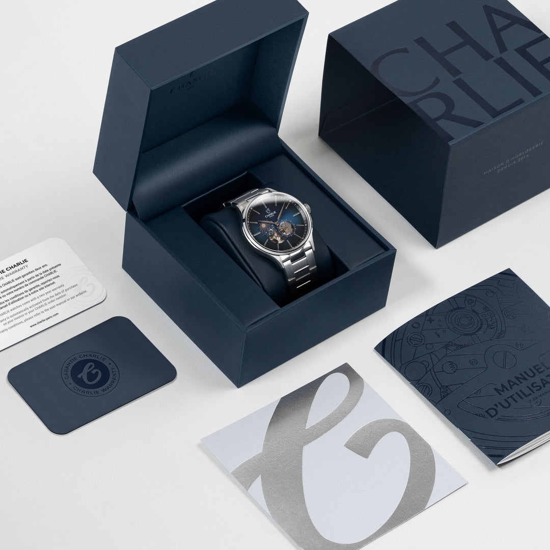 Montre Charlie Paris INITIAL Open Heart Jour/Nuit Bleu 40 mm en acier inoxydable Charlie Paris Montre Montre Charlie Paris INITIAL Open Heart Jour/Nuit - Bleu 40 mm | Dépositaire Officiel Canada | Mathieu Blanchard Joaillerie Mathieu Blanchard Joaillerie