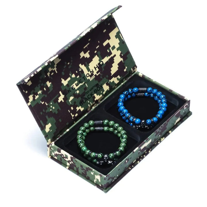 Quatuor de bracelets Strike en acier inoxydable SkeletonHD Bracelets Acier inoxydable Lot de 4 bracelets Strike Box - Camouflage, par SkeletonHD | Mathieu Blanchard Mathieu Blanchard Joaillerie